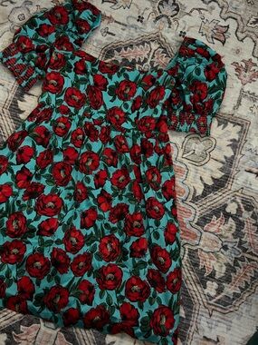 Red Floral Puff Sleeve Dress on Teal Background